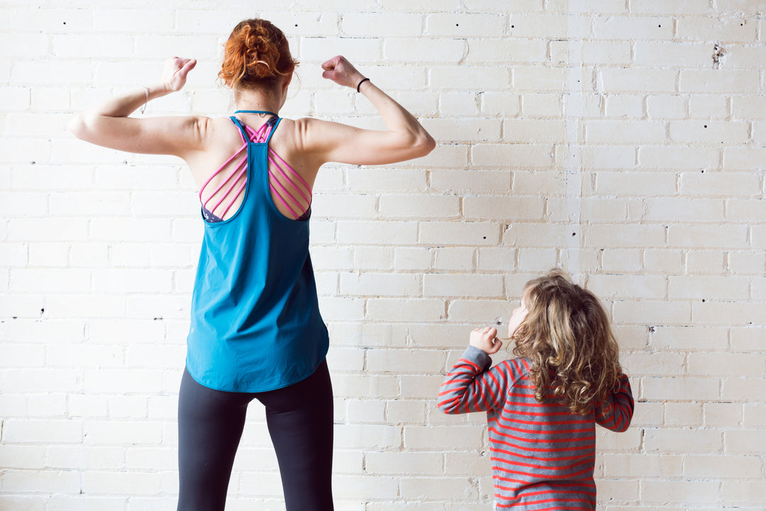 Mom and Daughter Flexing their muscles